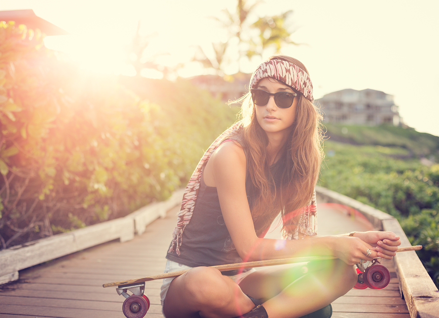 Fashion lifestyle, Beautiful young woman with skateboard, backli