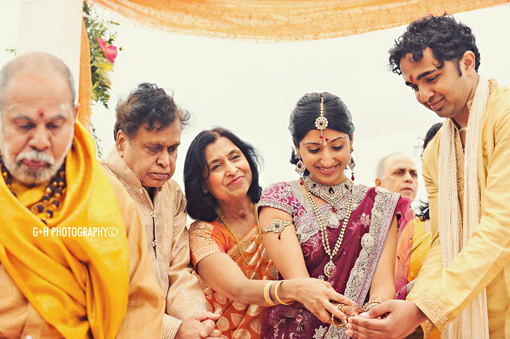 Hindu Wedding Ceremony in the sand by G + H Photography
