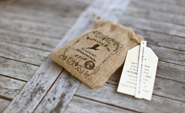 Printed Burlap Pouches filled with Little Hints: Our Wedding Save the Dates
