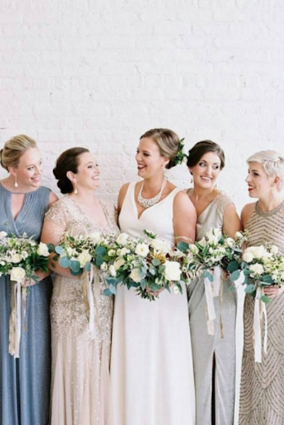 A bride and her bridesmaids on her wedding day.