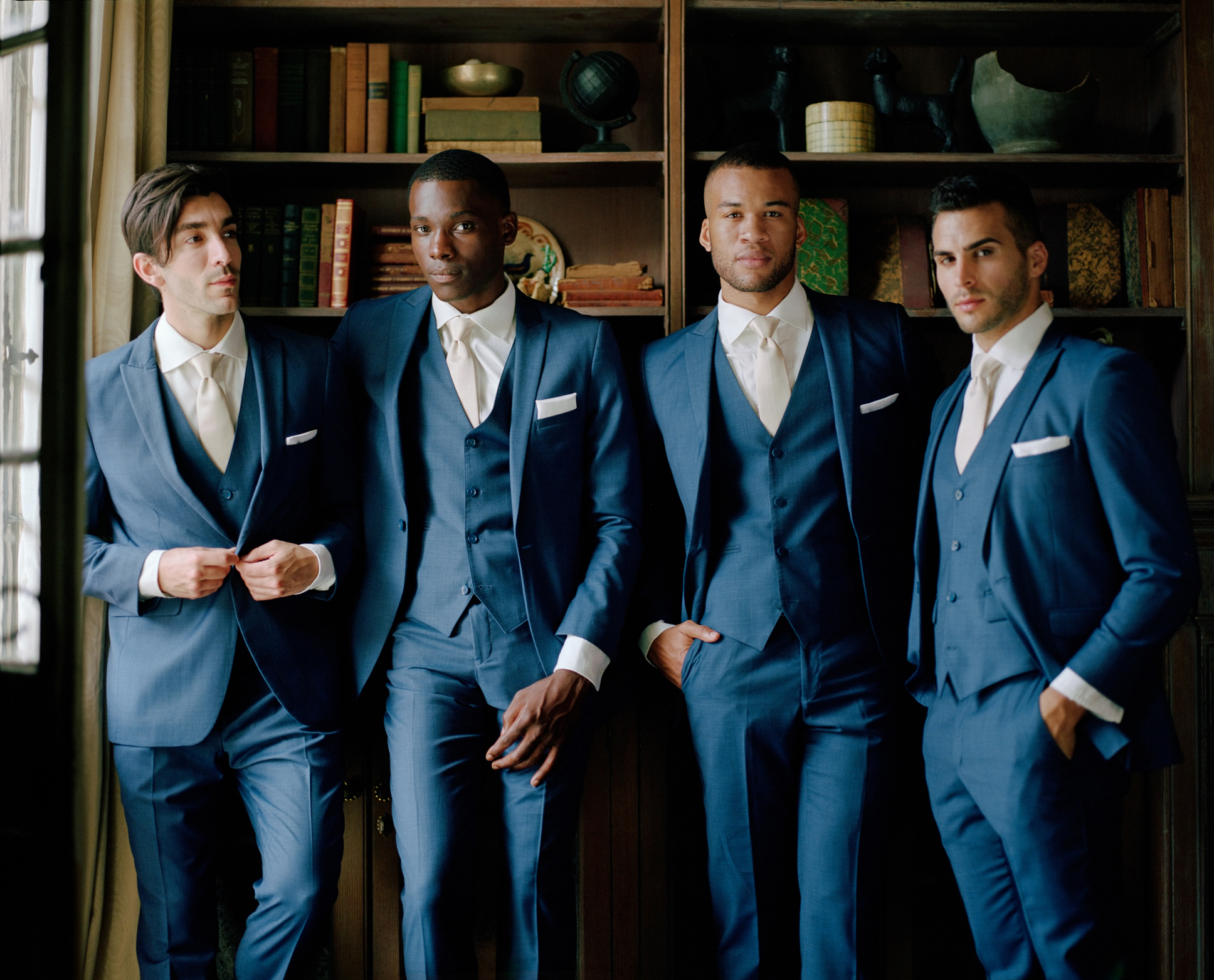 men in navy blue colored suits