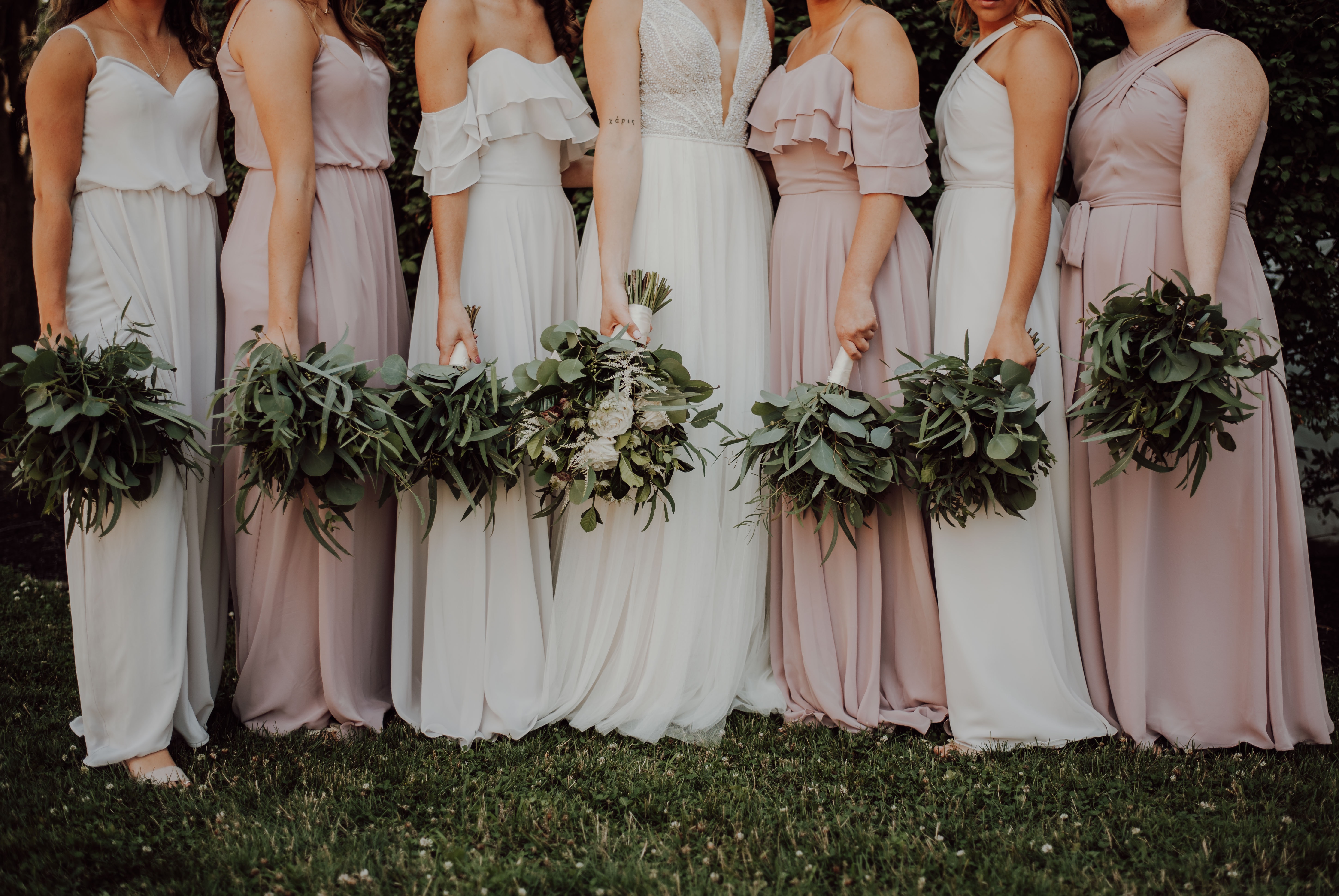 Bridesmaids in soft blush dresses